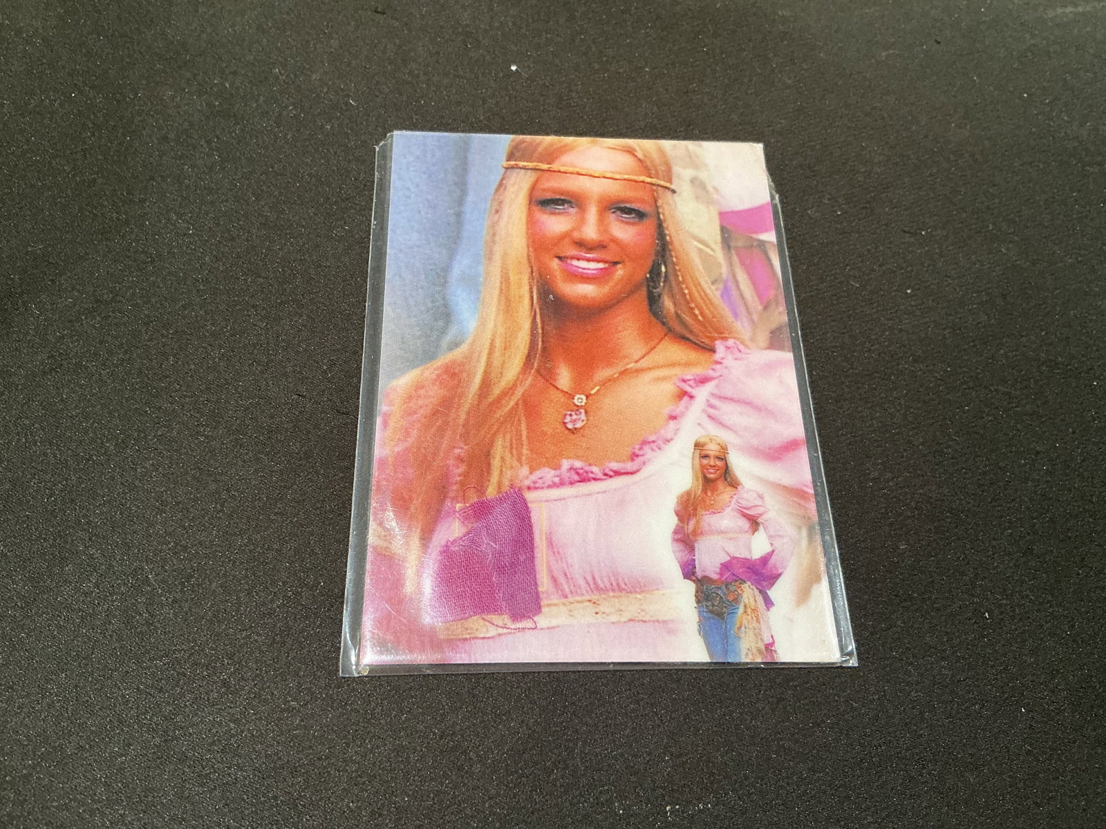 Britney Spears Certified Memorabilia Swatch Card: Making another appearance for pop culture collectors, this Britney Spears memorabilia card features an embedded fabric swatch accompanied by a Global Authentication certificate of authenticity. Part