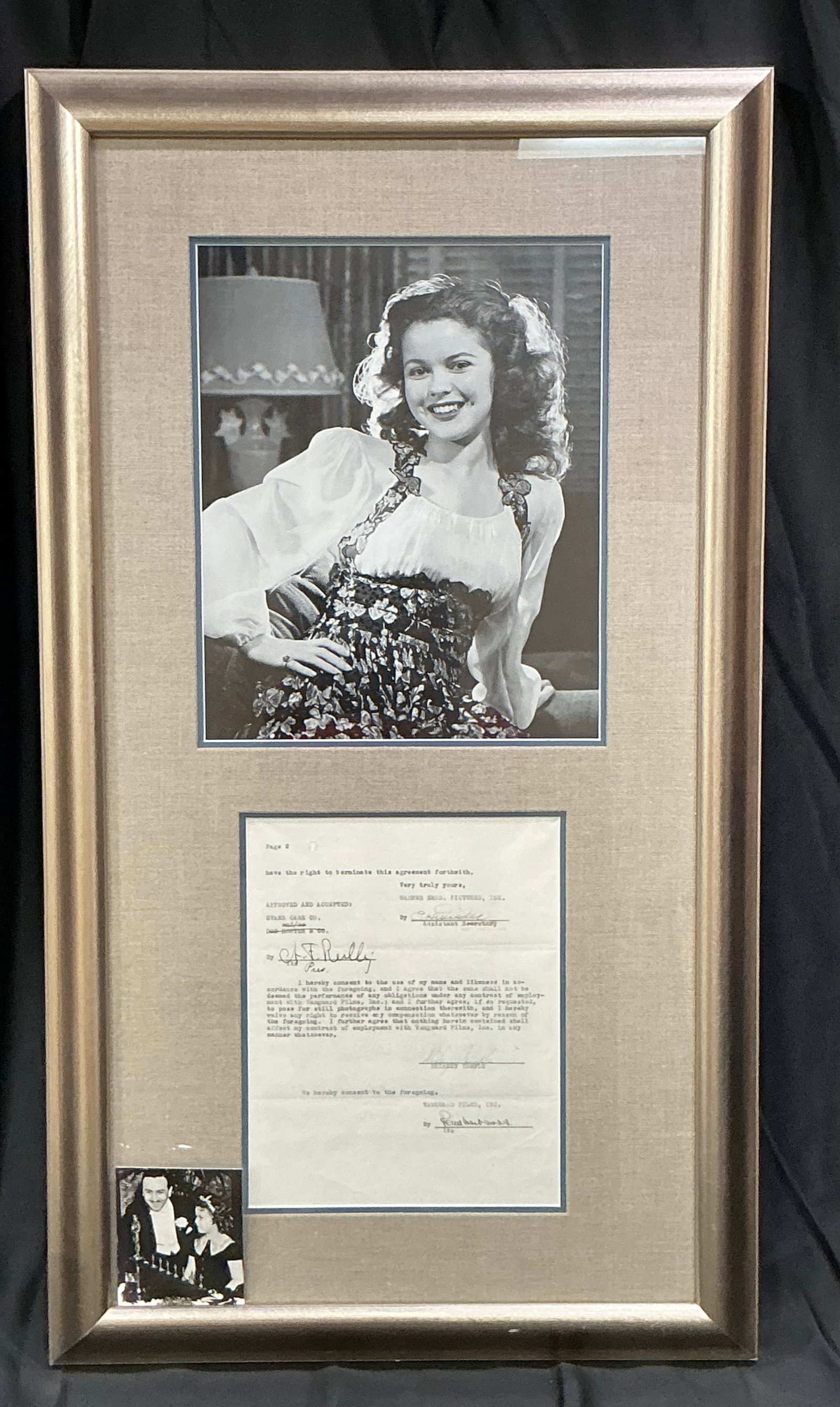 Shirley Temple Signed 1949 Warner Bros Contract Display: Returning as a distinctive piece of classic Hollywood memorabilia, this framed display features a Warner Bros. Pictures Inc. document dated August 1, 1949 relating to the use of Shirley Temple's name 