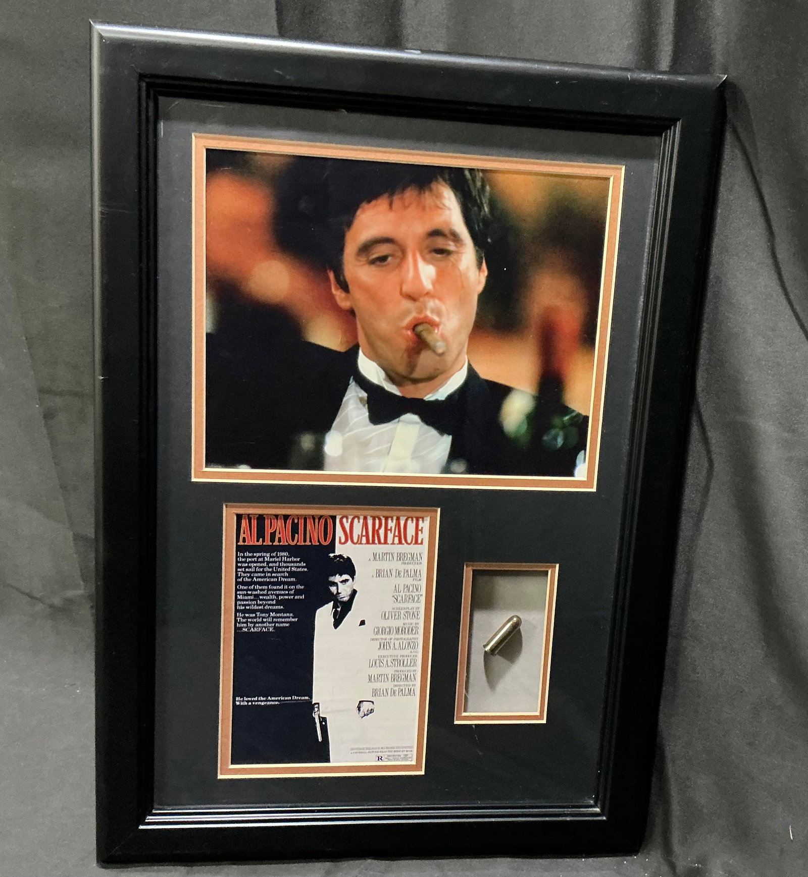 Al Pacino Scarface Framed Display with Bullet Prop: Framed Scarface display featuring Al Pacino as Tony Montana, including a film still, poster-style insert, and mounted bullet prop. A striking tribute piece to the iconic 1983 crime film with strong