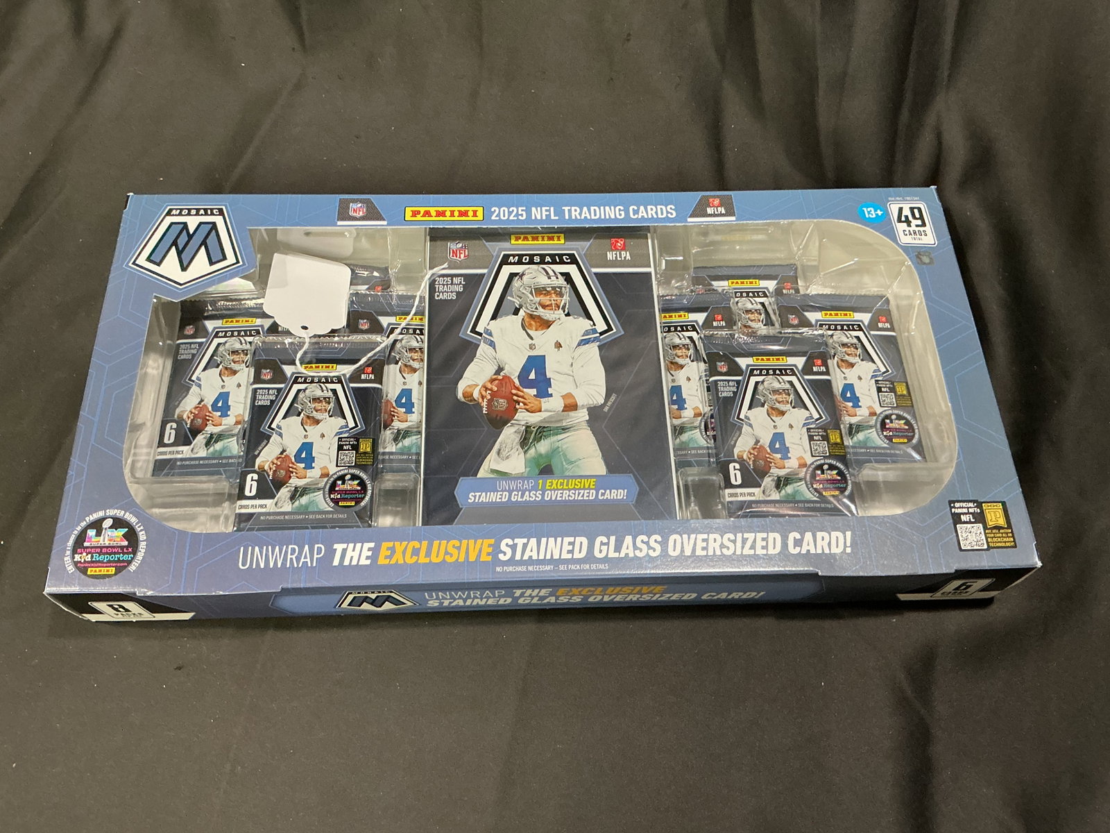 2025 Panini Mosaic NFL Stained Glass Box: 2025 Panini Mosaic NFL trading card box featuring Dallas Cowboys quarterback Dak Prescott on the packaging. The 49-card format includes Mosaic football packs and advertises one exclusive Stained