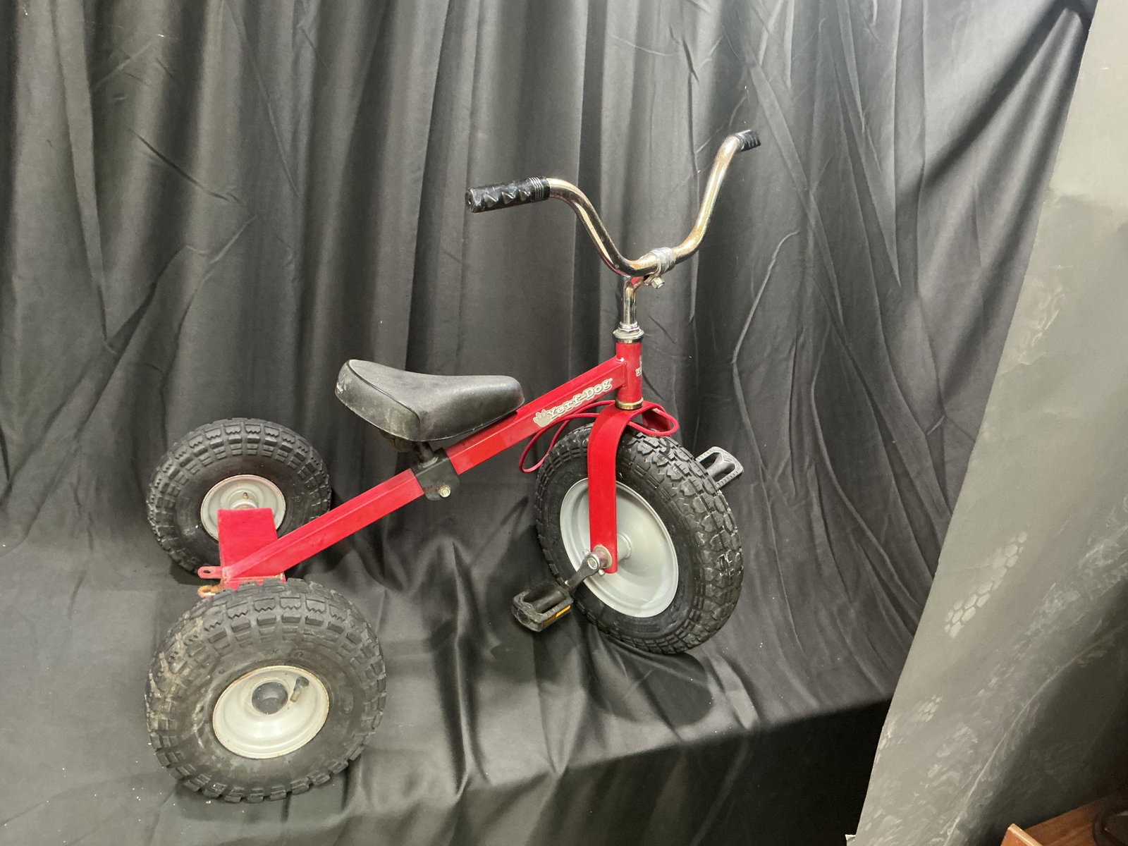 Vintage Zer-Dogs Red Children's Tricycle Balloon Tires: Offered once more, this vintage Zer-Dogs children's red tricycle features a classic metal frame, black saddle seat, and original balloon-style rubber tires. Its period construction and well-used appea