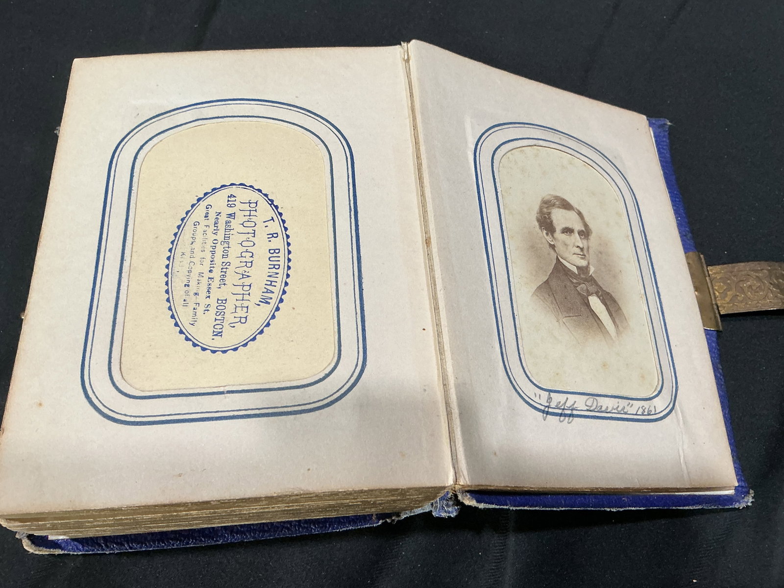Civil War Portrait Album Lincoln Grant Davis: Well suited for display and collecting, this ornate 19th century photograph album features Civil War era portraits signed and identified as Abraham Lincoln, U.S. Grant, and Jefferson Davis, alongside