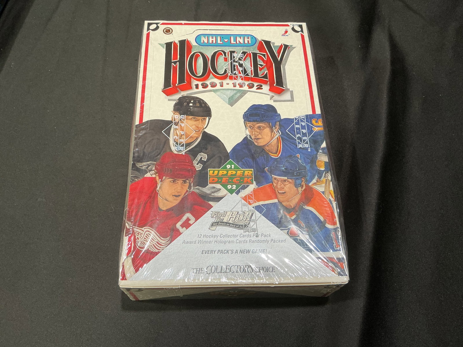 1991-92 Upper Deck NHL Hockey Sealed Wax Box: Representing its era of sports collecting, this sealed 1991-92 Upper Deck NHL hockey trading card box comes from one of the most recognizable early-1990s wax eras. The hologram-driven Upper Deck