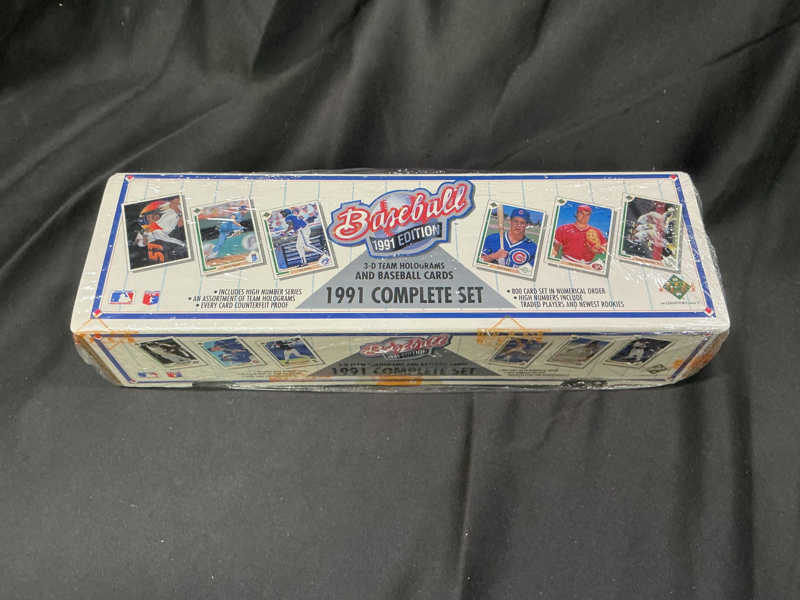 1991 Baseball Complete Factory Set 800 Cards: A strong sports collectible, this factory sealed 1991 Baseball complete factory set includes 800 cards in numerical order with traded players, newest rookies, and 3-D team holograms. A nostalgic seale