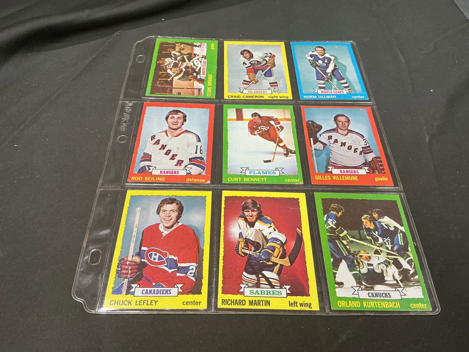 1973-74 Topps Hockey 9-Card Lot with Norm Ullman: This nine-card 1973-74 Topps hockey group is highlighted by Hockey Hall of Famer Norm Ullman #148 along with Richard Martin #155 and Orland Kurtenbach #157. Also included are Rod Seiling #9 Cesare Man