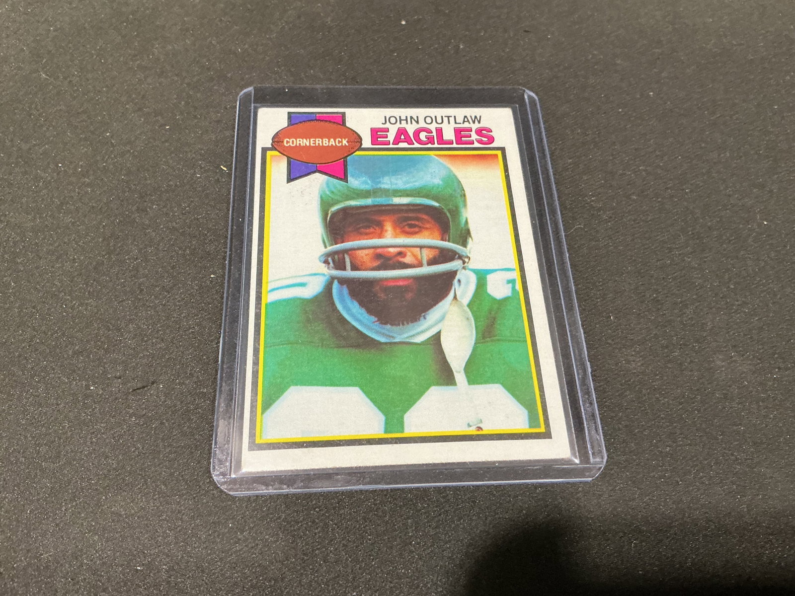 1979 Topps John Outlaw Eagles #176: New to the auction, this 1979 Topps football card #176 features Philadelphia Eagles cornerback John Outlaw in the team's classic green uniform. The reverse highlights his career interception record