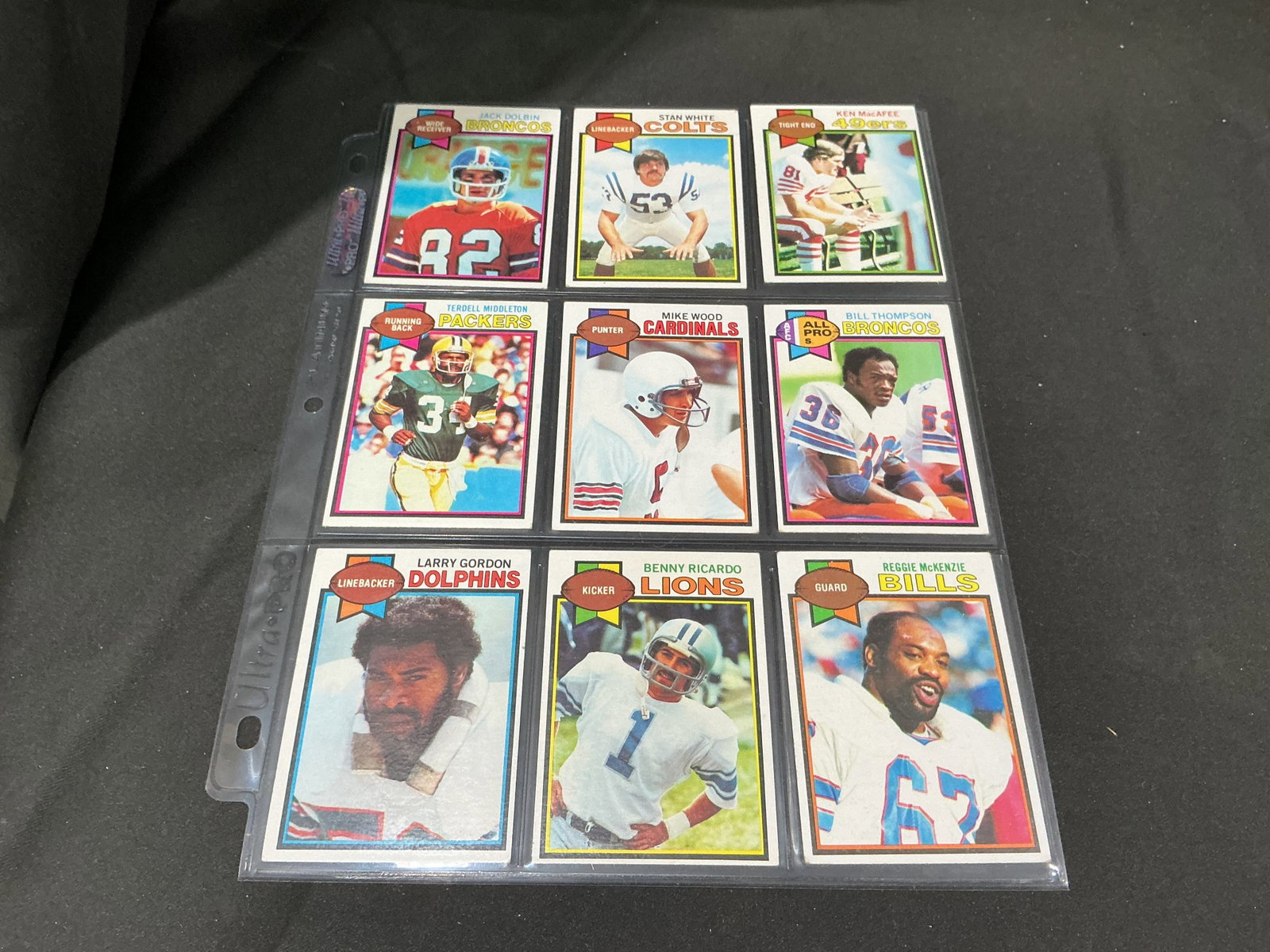 1979 Topps Football 9-Card Vintage Lot: Fresh to the auction, this nine-card grouping of 1979 Topps football cards features Jack Dolbin, Stan White, Ken MacAfee, Terdell Middleton, Mike Wood, Bill Thompson, Larry Gordon, Benny Ricardo, and 