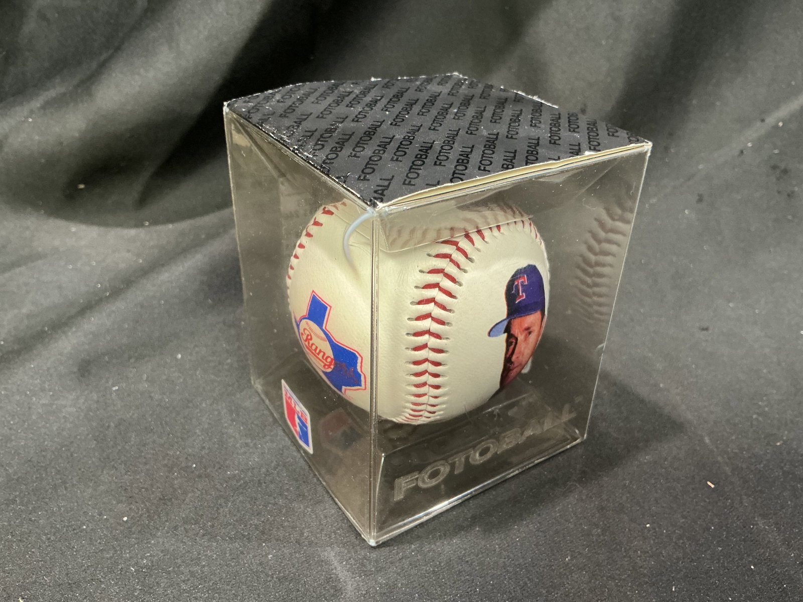 Nolan Ryan 5000th Strikeout Texas Rangers Fotoball: A colorful Texas Rangers collectible commemorating Nolan Ryan becoming the first pitcher in Major League Baseball history to reach 5,000 career strikeouts. This officially licensed Fotoball features R