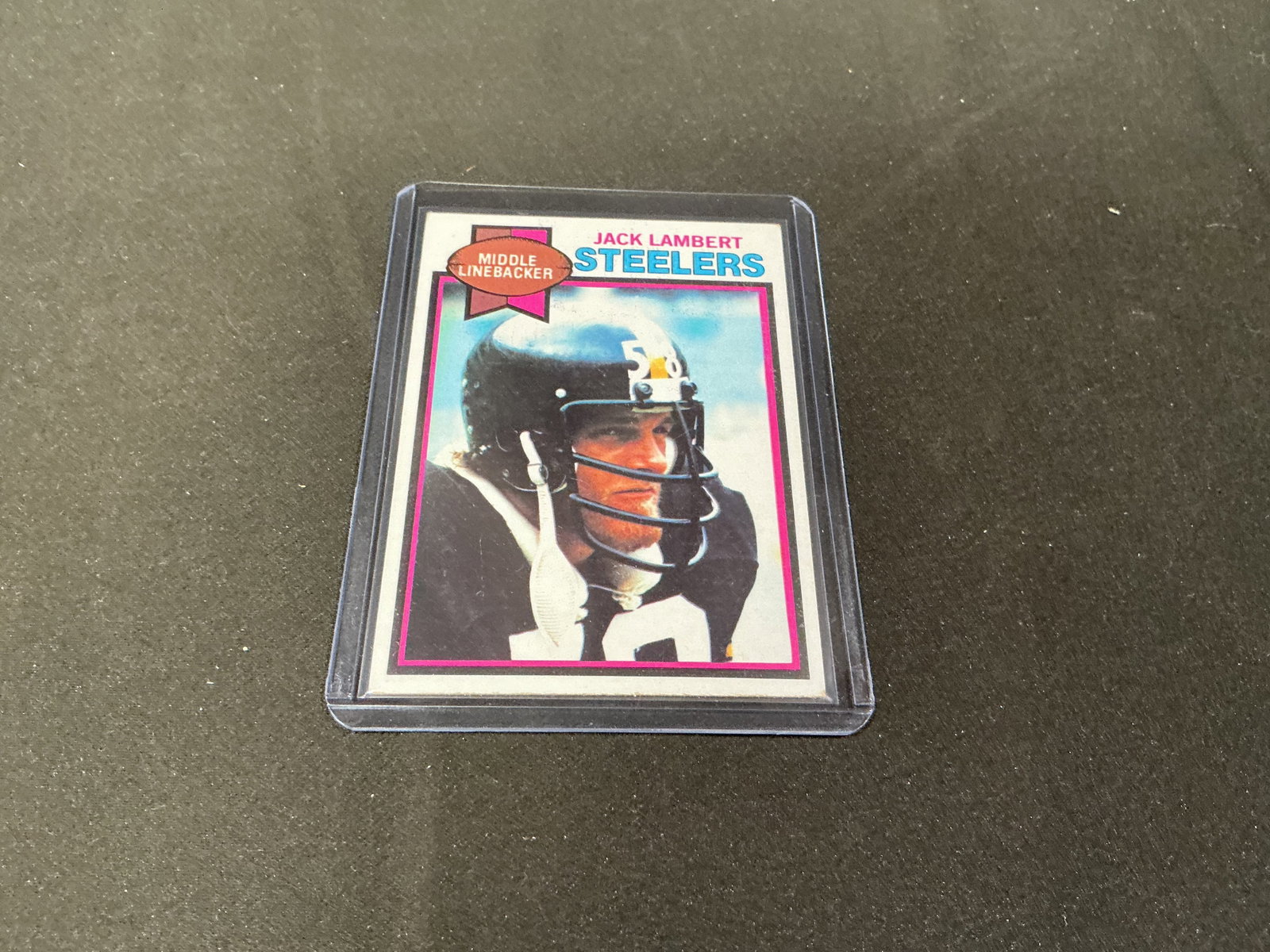1979 Topps Jack Lambert Steelers #475 Hall of Fame: Featured individually, this 1979 Topps football card #475 features Pittsburgh Steelers middle linebacker Jack Lambert, one of the defining defensive stars of the Steelers dynasty. The card notes four 
