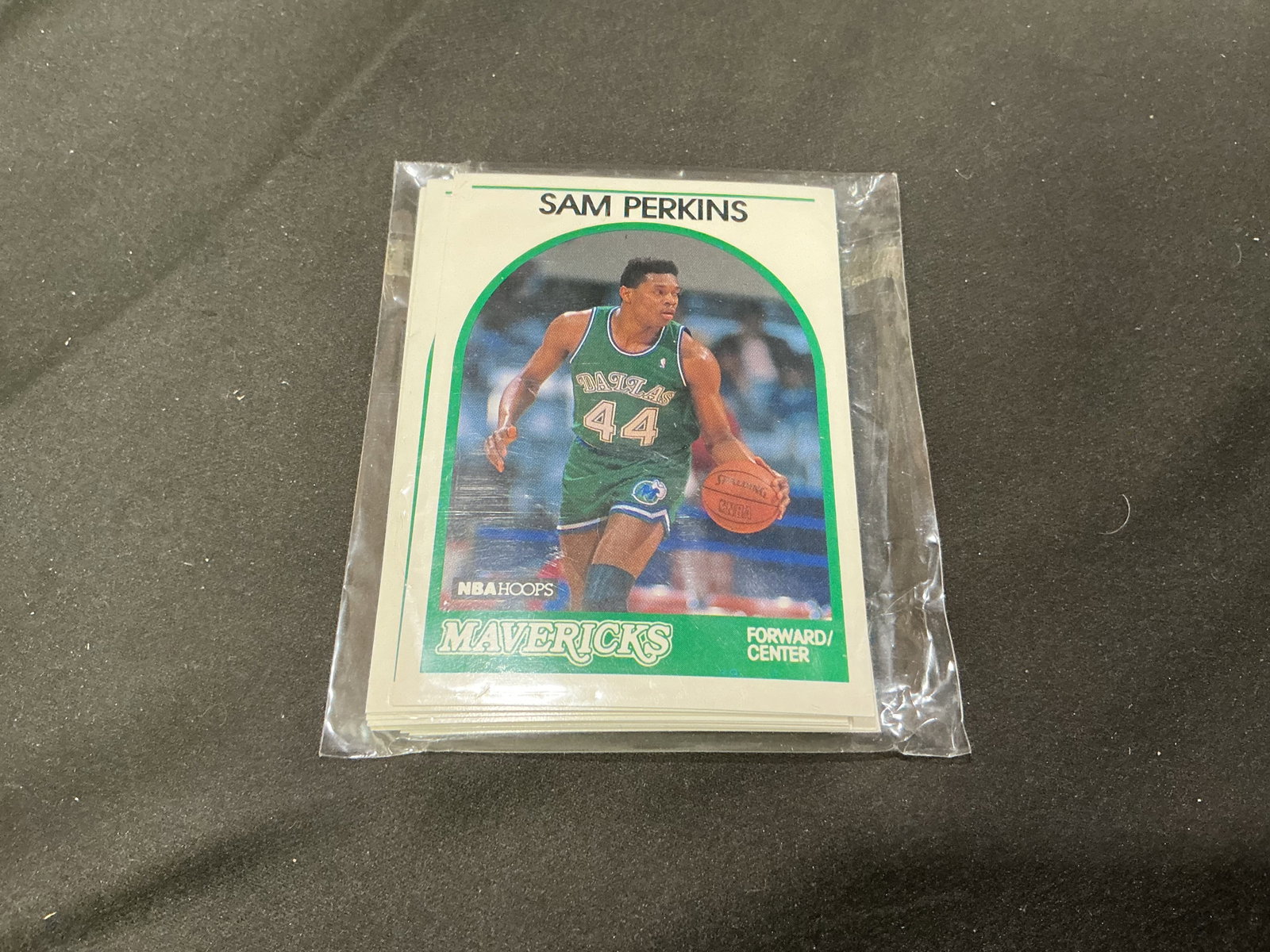 1989-90 NBA Hoops Sam Perkins Mavericks Team Card Set: A Dallas Mavericks team grouping from the inaugural 1989-90 NBA Hoops basketball release, with Sam Perkins pictured in his #44 Mavericks uniform on the front card and head coach John MacLeod #171 visi