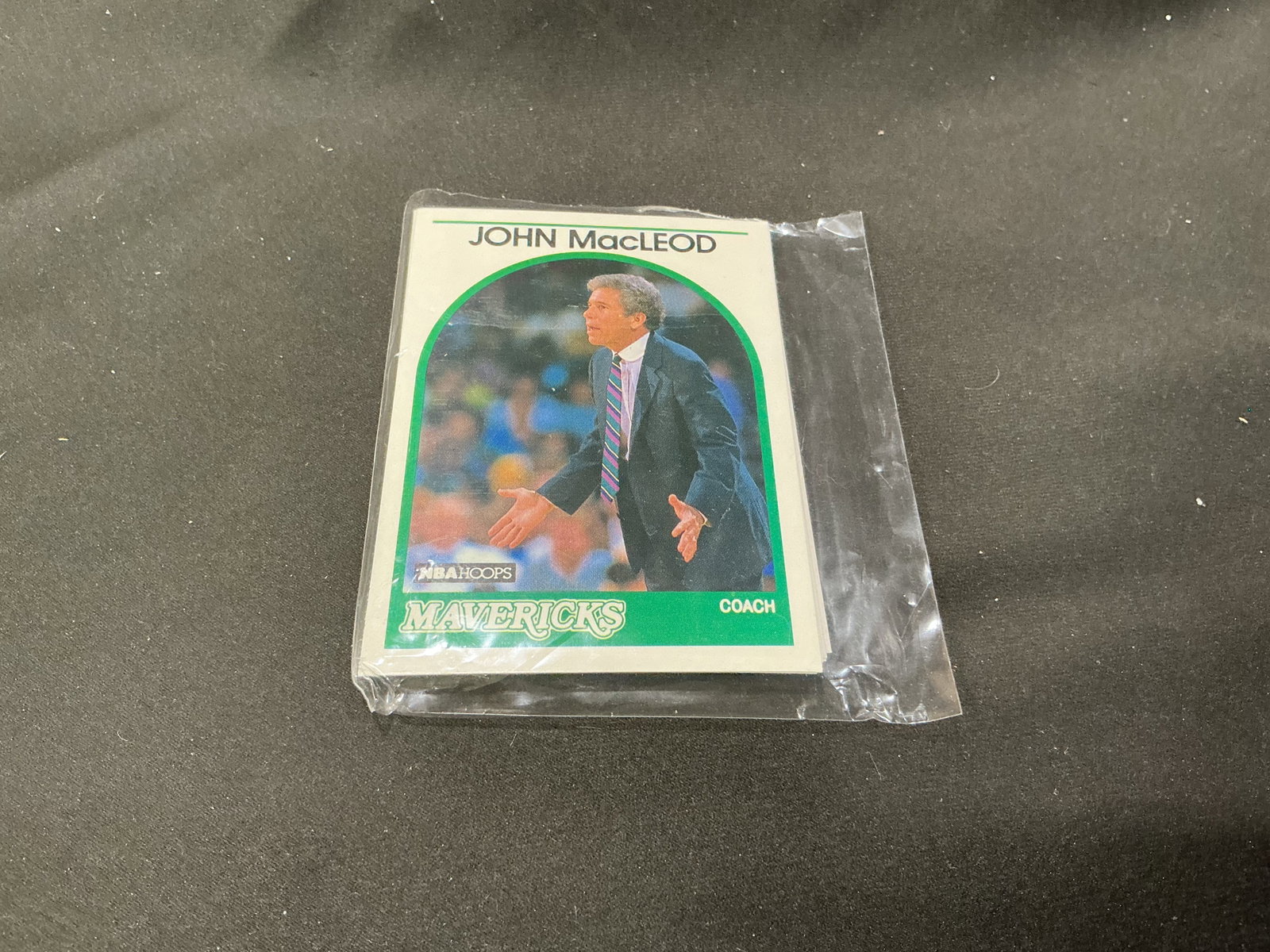 1989-90 NBA Hoops Dallas Mavericks Team Card Set featuring coach John MacLeod: Another Dallas Mavericks team grouping from the inaugural 1989-90 NBA Hoops basketball release, with head coach John MacLeod pictured on the front card and Sam Perkins #286 visible at the reverse. The