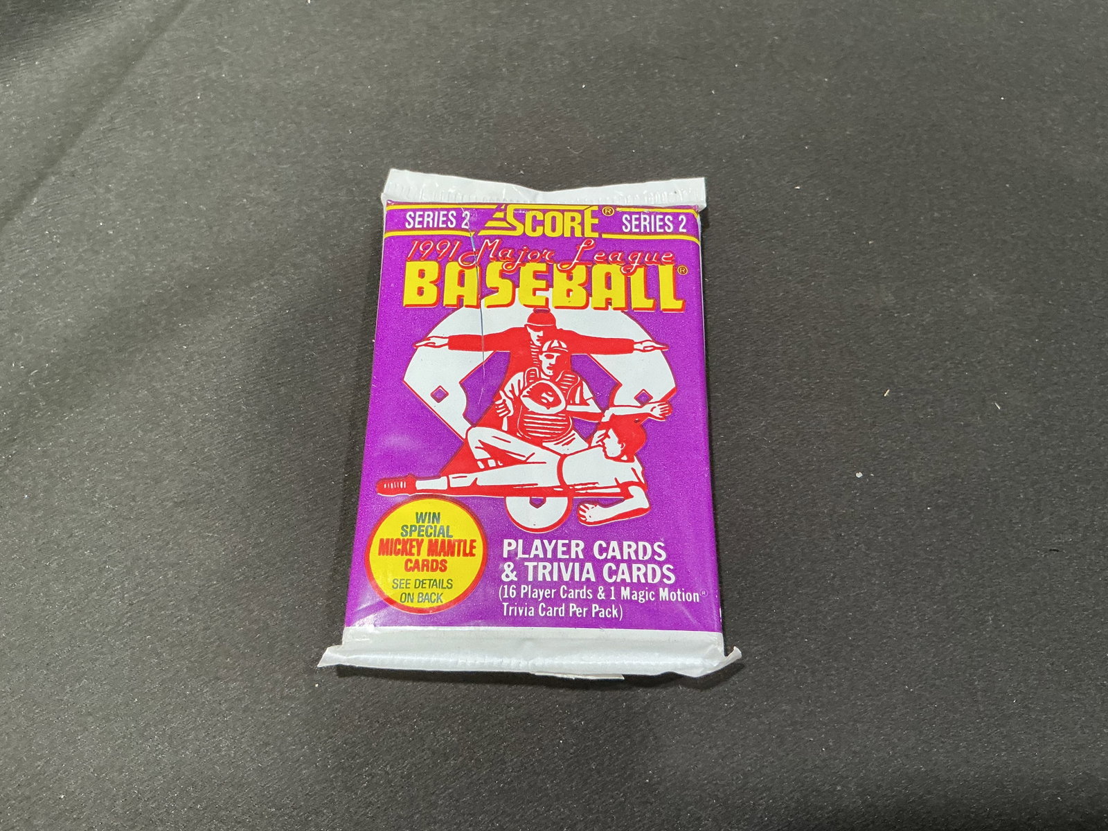 1991 Score Series 2 Baseball Factory Sealed Pack: Still unopened, this factory sealed 1991 Score Major League Baseball Series 2 pack containing 16 player cards and one Magic Motion trivia card. Series 2 includes key rookie-era cards such as Chipper J