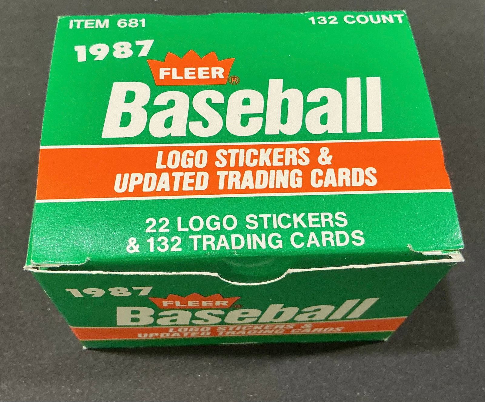 1987 Fleer Baseball Update 132-Card Factory Set: Presented in its original green and orange Fleer box, this 1987 Fleer Baseball Update factory set containing 132 updated trading cards and 22 team logo stickers. Distributed in complete-set form, the 