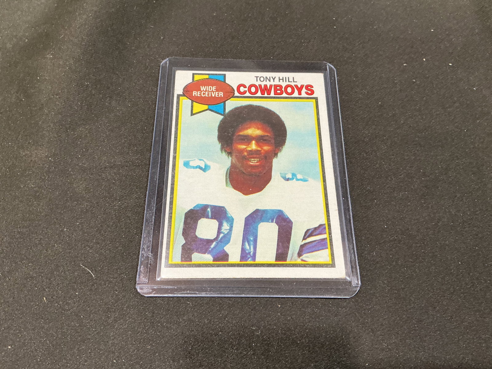 1979 Topps Tony Hill Rookie Card #182 Cowboys: Making its first appearance in our auction, this 1979 Topps football card #182 features Dallas Cowboys wide receiver Tony Hill and is recognized as his rookie card. The front presents Hill in his