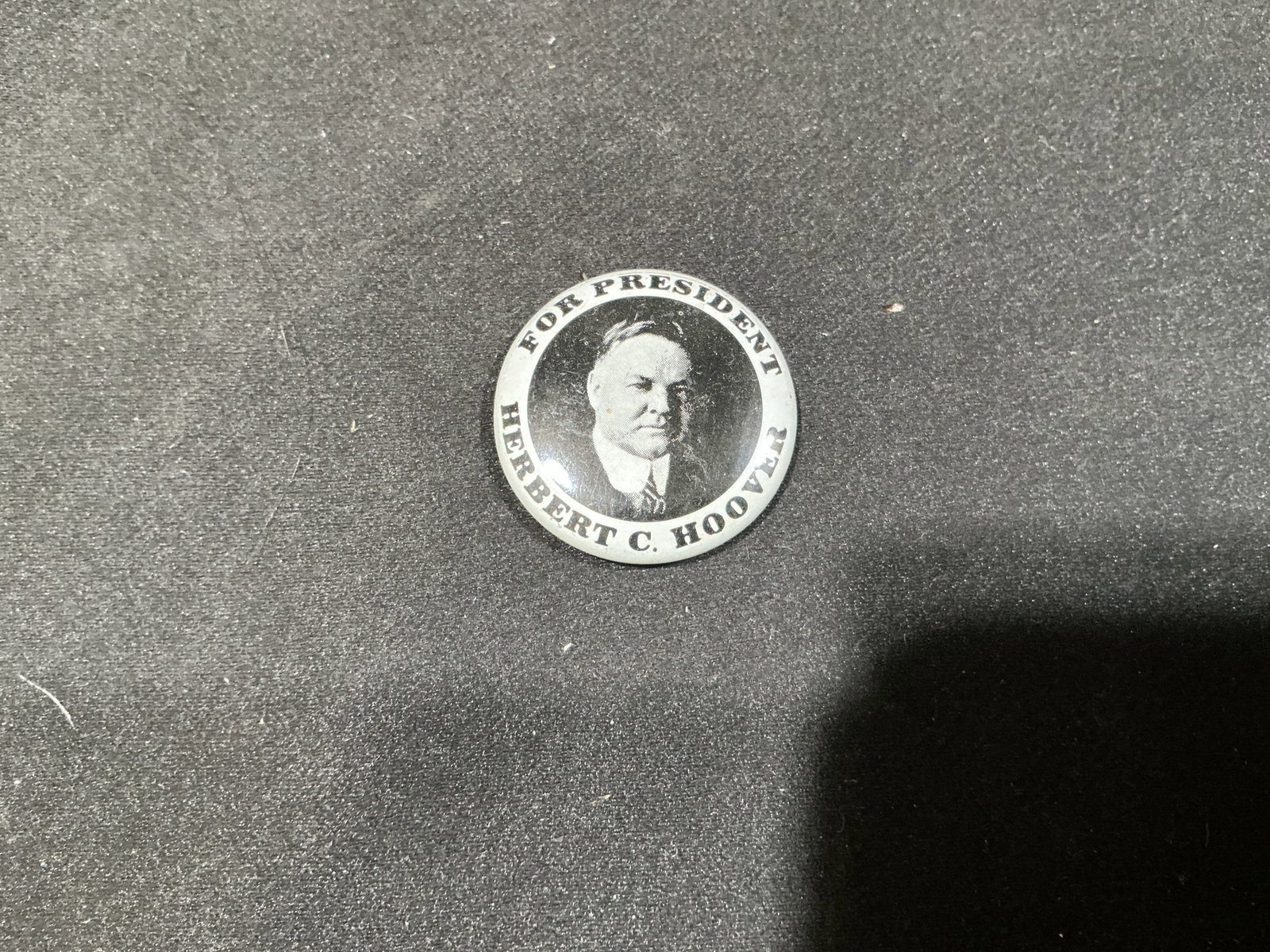 Herbert C. Hoover For President Reproduction Pinback: Presented for the first time in our auction, this black-and-white political pinback features a portrait of Herbert C. Hoover surrounded by the wording "For President Herbert C. Hoover." The reverse