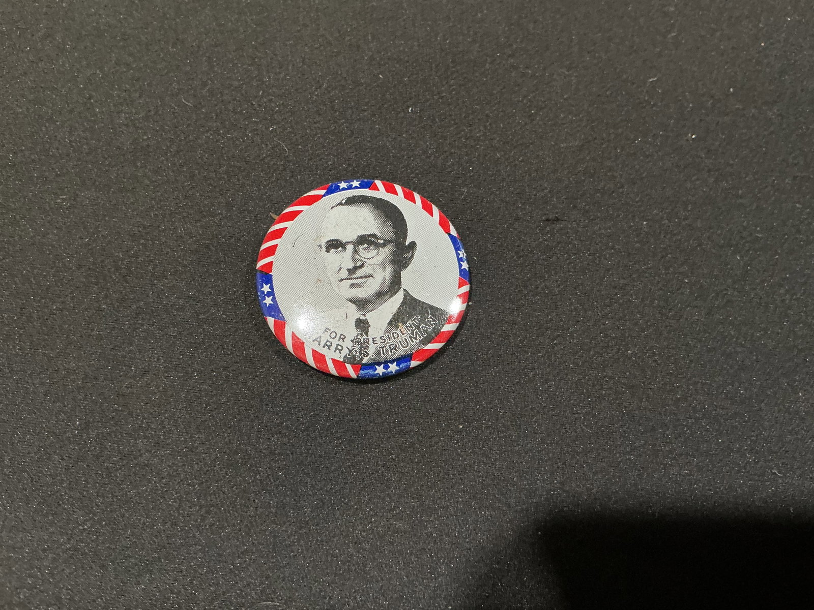 Harry S. Truman For President Reproduction Pinback: A patriotic red, white and blue portrait pinback joins the political memorabilia offerings, featuring Harry S. Truman with "For President" lettering beneath his image. The reverse paper is repeatedly