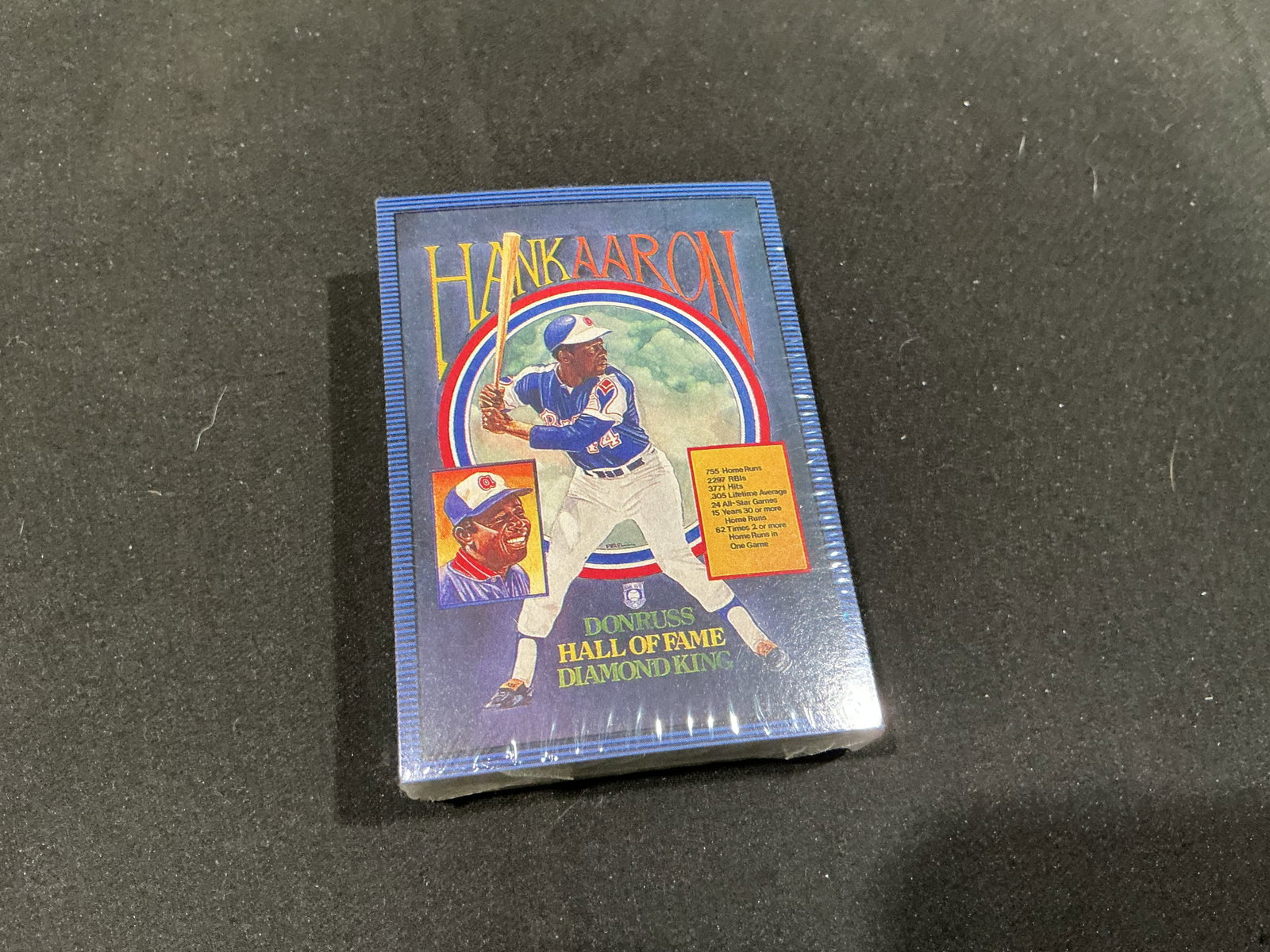 1986 Donruss Hank Aaron Hall of Fame Diamond King Sealed Set: Centered on baseball legend Hank Aaron, this vintage Donruss Hall of Fame Diamond King card set remains factory shrink-wrapped with Aaron prominently featured on the cover. Issued in conjunction with 