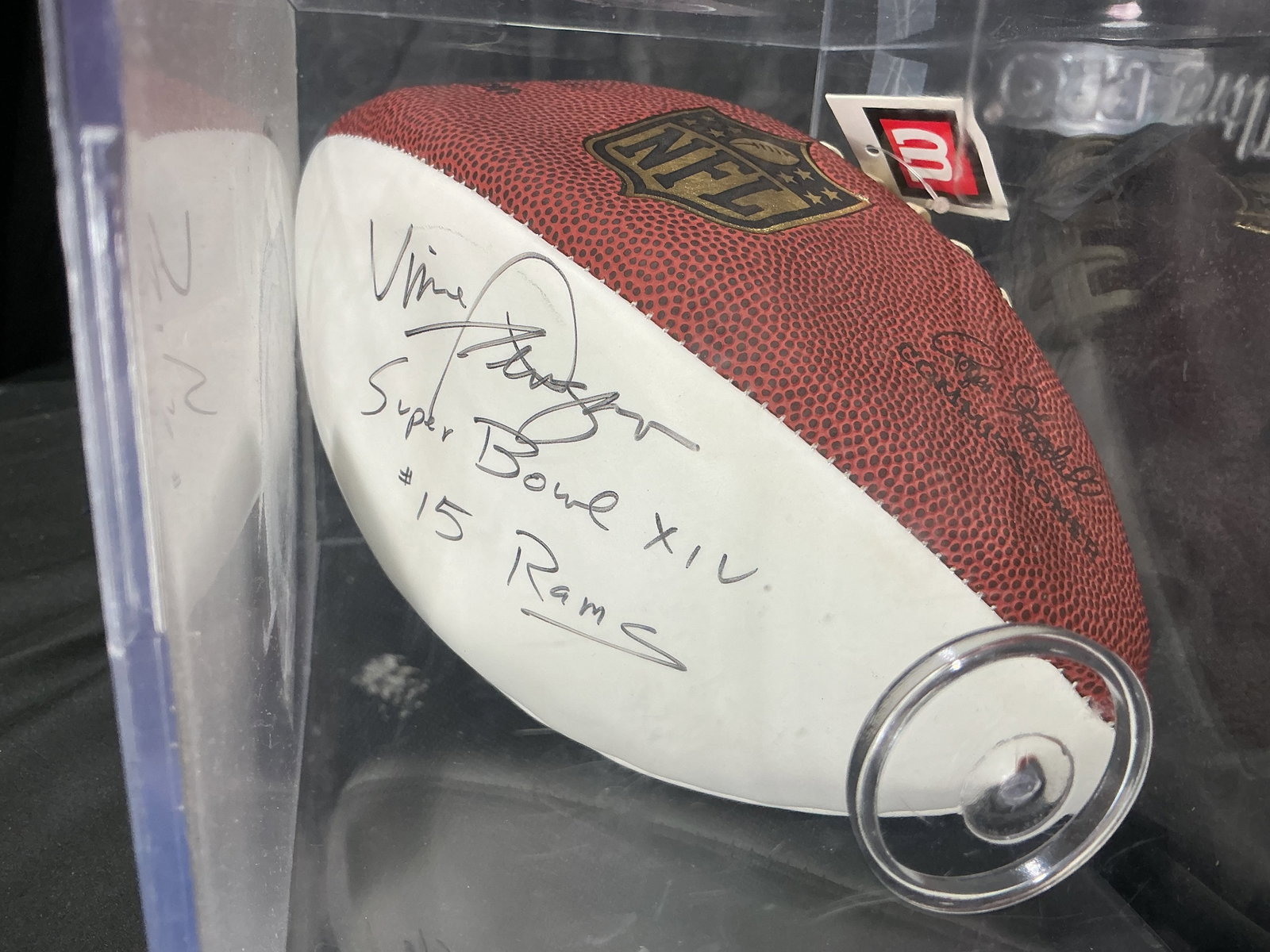 Autographed Vince Ferragamo NFL Football Super Bowl XIV: Making another appearance, this official NFL football is signed by Vince Ferragamo, quarterback for the Los Angeles Rams, and includes a Super Bowl XIV inscription. Presented in a clear protective