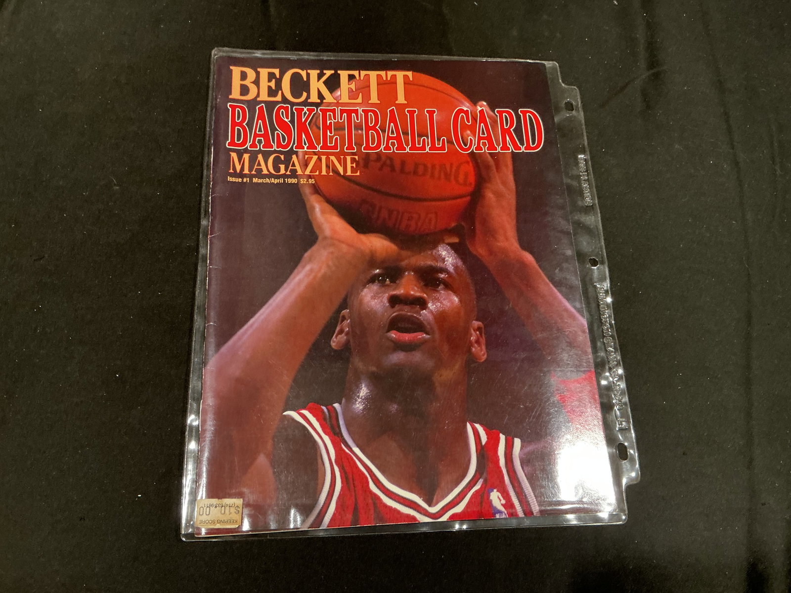 1990 Beckett Basketball Issue #1 featuring Michael Jordan & Patrick Ewing: The inaugural March/April 1990 issue of Beckett Basketball Card Magazine features Michael Jordan shooting on the front cover, while the reverse features New York Knicks star Patrick Ewing with an