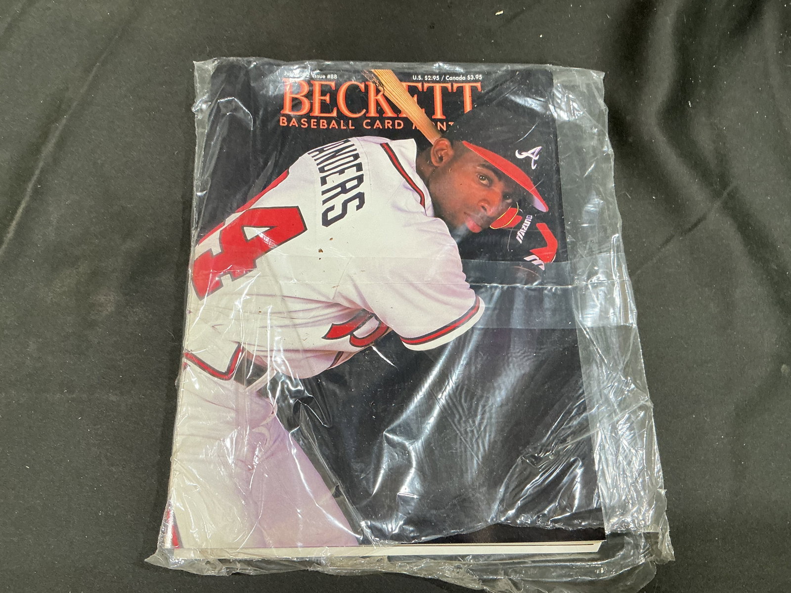 1992 Beckett Baseball Card Monthly #88 Deion Sanders: Deion Sanders appears in an Atlanta Braves uniform on the cover of Beckett Baseball Card Monthly Issue #88 from July 1992. Published during the height of Sanders' rare two-sport career, the magazine