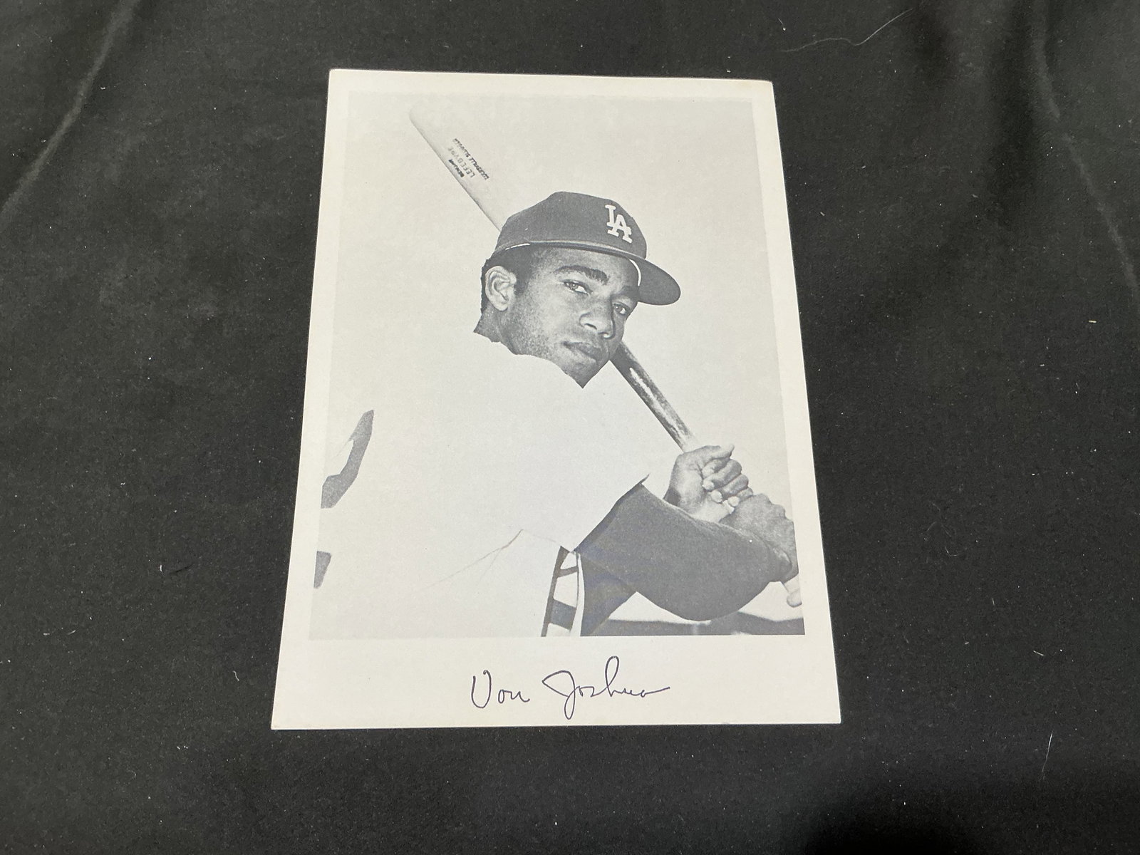 Von Joshua Signed Los Angeles Dodgers Photo: Los Angeles Dodgers outfielder Von Joshua is pictured in a black-and-white batting portrait wearing his LA cap, with a blue-ink signature along the lower white border. Joshua played multiple stints