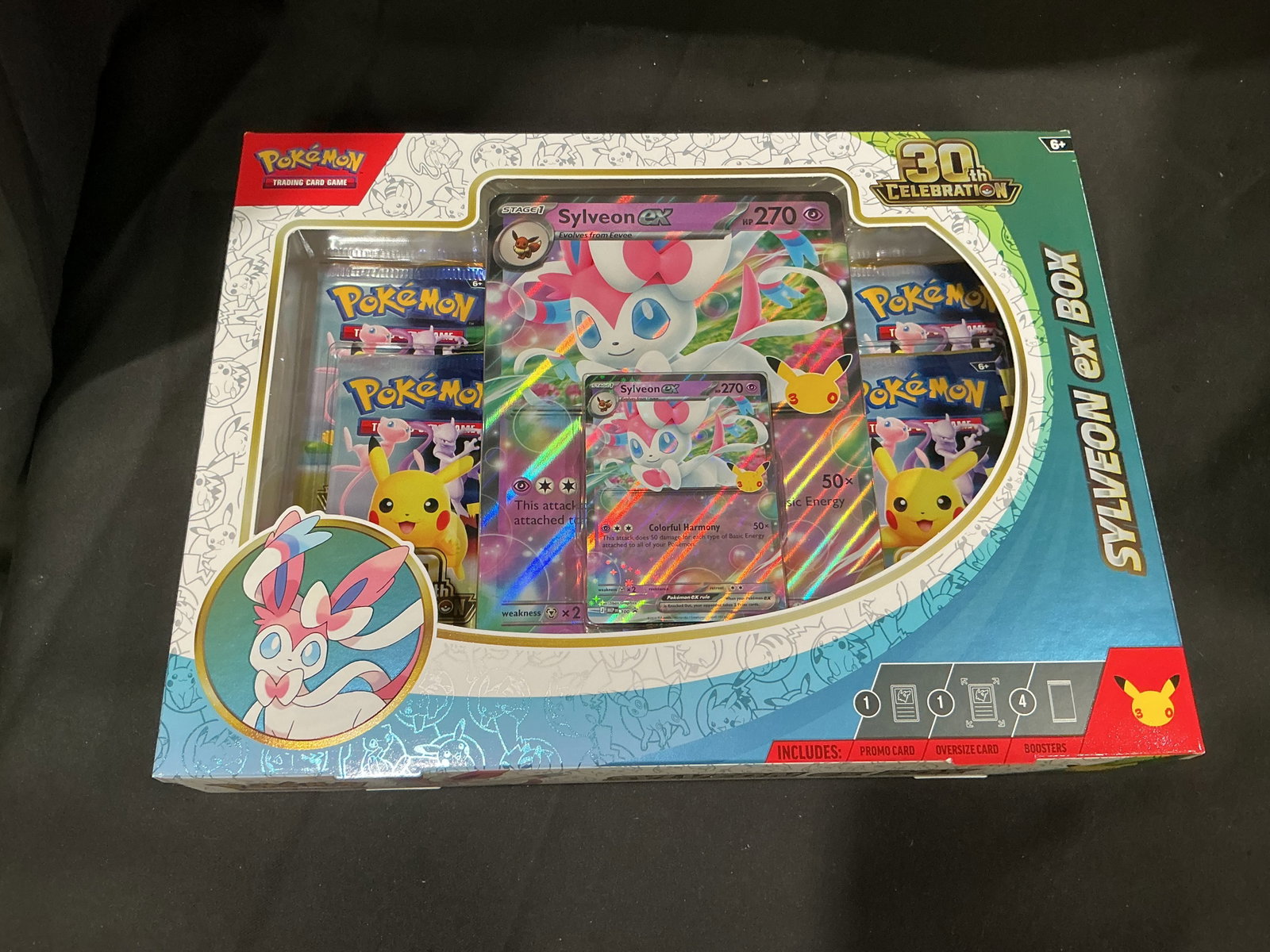 Pokemon 30th Celebration Sylveon ex Box Sealed: Making its first appearance in our auction as part of the newly released Pokemon TCG 30th Celebration lineup, this factory sealed Sylveon ex Box features one foil Sylveon ex promo card, one foil overs
