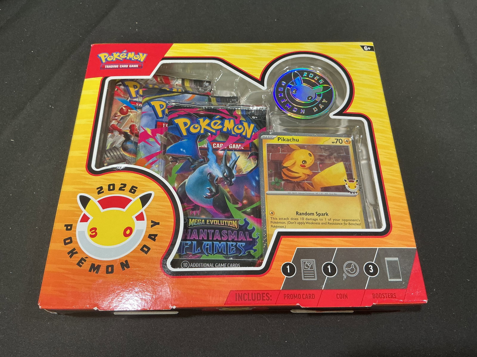 Pokemon Day 2026 Pikachu Collection Charizard Pack: Returns after its prior appearance, this factory sealed Pokemon TCG Pokemon Day 2026 Collection celebrates the 30th anniversary of Pokemon with a specially stamped foil Pikachu promo card, a metallic 