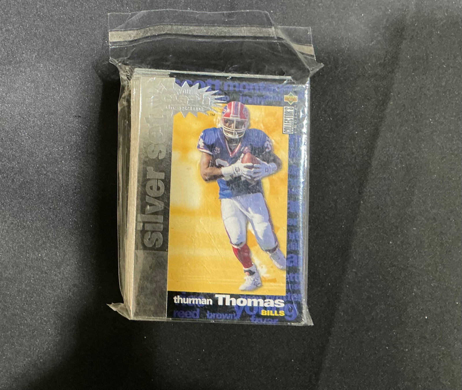 1995 Upper Deck Football Lot Thurman Thomas Rick Mirer: A compact vintage football card grouping highlighted by Buffalo Bills star Thurman Thomas on an Upper Deck Collector's Choice Silver Signature card and a Rick Mirer Rookie of the Year card. The assort