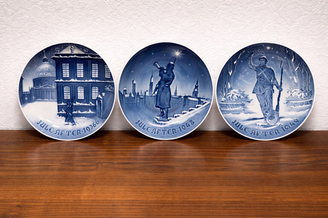 Royal Copenhagen Christmas plates (Jule Aften series)1936, 1948,1949: Set of 3 vintage Royal Copenhagen Christmas plates from 1936, 1948, and 1949. These earlier Jule Aften series pieces feature classic Danish winter scenes in cobalt blue porcelain with fine detail and
