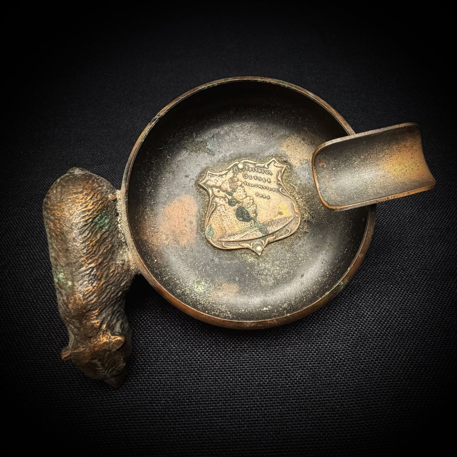 Vintage Bear Yellowstone Souvenir Ashtray: This is a metal ashtray featuring a figural bear on the side. The interior of the bowl has an affixed shield-shaped badge. The badge reads "Souvenir" . Souvenir, Tobacciana, Yellowstone, Bear Figurine