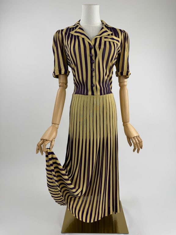 Vintage 1930s Chanel Stripe Knit Deco Day Dress: Vintage 1930s Chanel Adaptation Yellow & Purple Stripe Rayon Knit Art Deco Short Sleeve Day Dress. Notched collar with short puffed sleeves. Zips at side to close. Pleated through skirt. Slight stretc