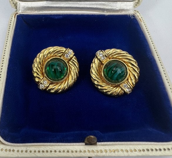 Givenchy Pair of French Costume Jewelry Earrings: Givenchy Pair of French Costume Jewelry Earrings. Signed clip on earrings. Gilt metal, rhinestones and emerald paste cabochon. Each measures 1 inch in diameter.