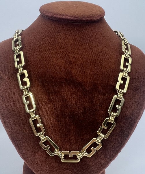 Givenchy French Costume Jewelry Necklace: Givenchy French Costume Jewelry Necklace. Signed on clasp. Gilt metal. G logo design panel link construction. Measures 18 inches in length.