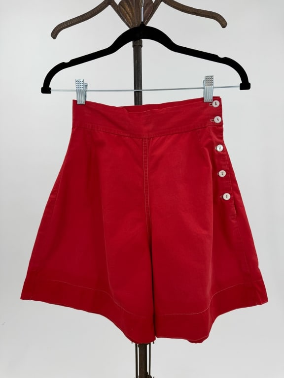 Vintage 1930s Red Cotton Side Button Sports Shorts: Vintage 1930s Red Cotton Side Button Sportswear Shorts. Wide legs with MOP buttons at side. Good vintage condition with light wear throughout consistent with age. Waist: 24" - 25" / Rise: 15" / Length