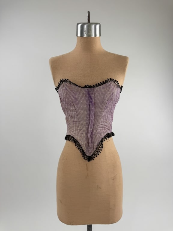 Antique 1860s Cotton Lace Trim Swiss Waist Corset: Antique Victorian 1860s Civil War Era Purple Printed Cotton Calico Lace Trimmed Swiss Waist Boned Corset. Closes up center front with hooks. Light wear consistent with age. Fading through front as sho