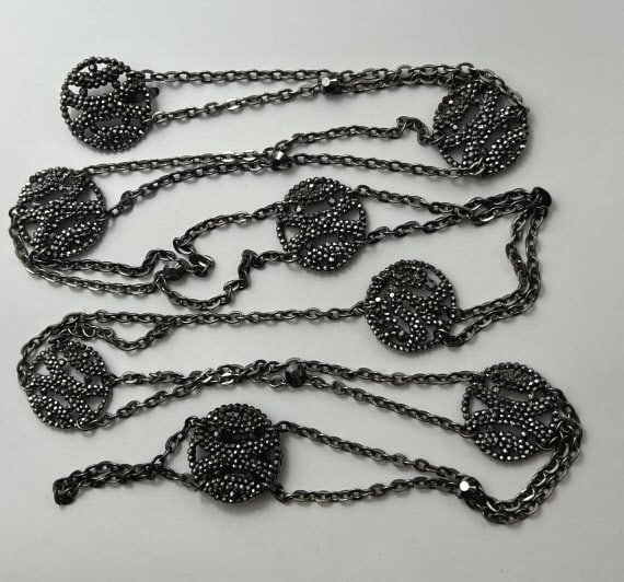 Antique 19th C Victorian Cut Steel Belt / Necklace: Antique 19th C Victorian Cut Steel Belt / Necklace. Having eight round stations set with cut steel connected by rolo link chain. Measures 46 inches in length.