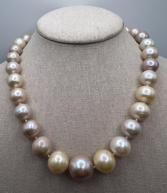 Impressive South Sea Baroque Pearl Necklace Strand: Impressive South Sea Baroque Pearl Necklace Strand. Hand knotted on silk thread. Cultured South Sea baroque pearls with beautiful luster in white, pink, cream and champagne iridescent hues. Largest pe