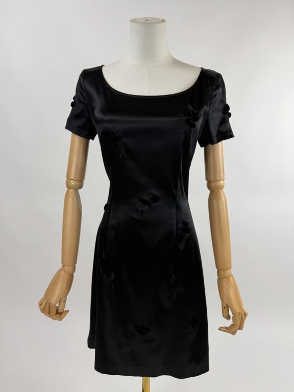 Vintage 1990s Vivienne Tam Black Knit Floral Dress: Vintage 1990s Vivienne Tam Black Knit Floral Dress. Short sleeve knit dress with 3D floral accents. No closures, slides over head. Stretch throughout. Marked size 1. Measures 34 - 40 inch bust, 28 - 3