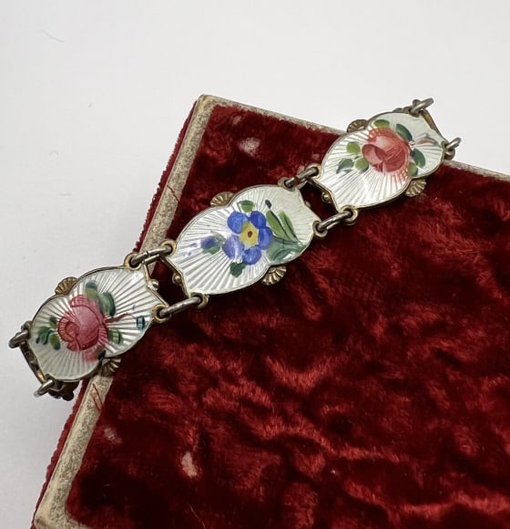 Estate Silver & Guilloche Enamel Floral Bracelet: Estate Silver & Guilloche Enamel Floral Bracelet. Articulated panel design, each panel with guilloche enamel background and floral design. Gold wash over silver and hallmarked. Has a safety chain. Mea