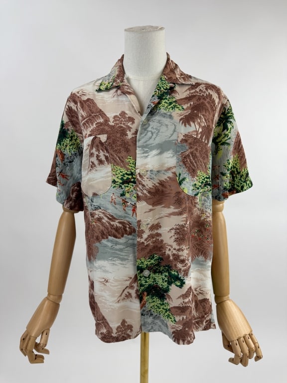 Vintage 1960s Penney's Rayon Hawaiian Polo Shirt: Vintage 1960s Penney's Rayon Hawaiian Polo Shirt. Marked size Small 14 - 14.5. Made in Japan. Two front pockets. Loop collar with button front. Hawaiian scene throughout with mountains, oceans, figure