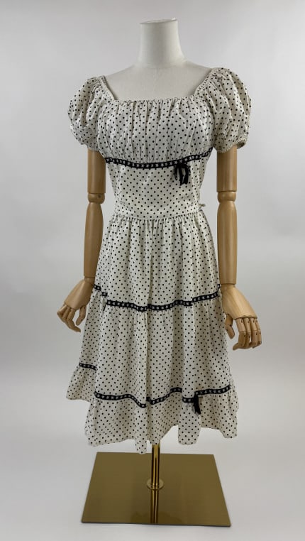 Vintage 1950s Black & White Polka Dot Dress: Vintage 1950s Black & White Polka Dot Square Dancing Tiered Ruffle Bow Dress. Elastic around neckline with short puffed sleeves with elastic cuffs. Zips up center back to close. Tiered, ruffled skirt.
