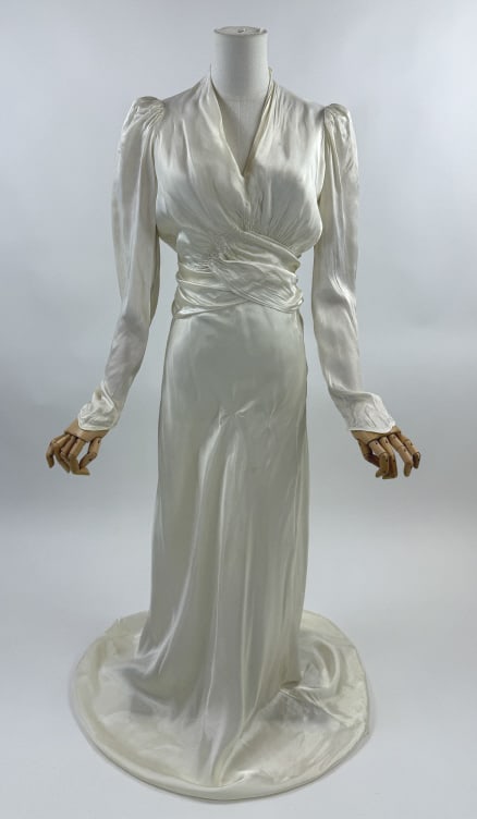 Vintage 1940s CC41 Rayon Satin Gown Wrap Dress: Vintage 1940s CC41 White Rayon Satin Gown Wrap Dress. Wrap style at waist with attached tie. Plunging neckline & long sleeves. Labeled A Gordon Gown. Good vintage condition with spots and repairs as s