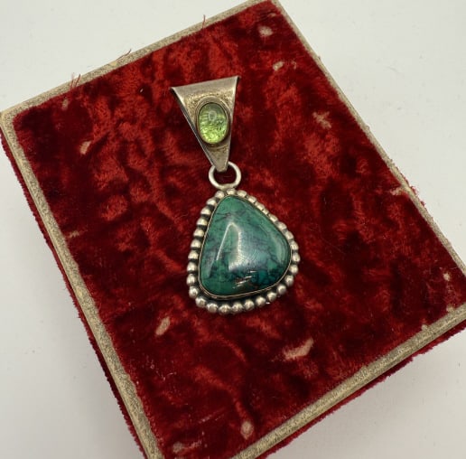 Native Paul Livingston Sterling Turquoise Pendant: Navajo Native Paul Livingston Sterling Gold Filled Turquoise Pendant Charm. Signed Paul Livingston & marked sterling & gold filled. Bezel set turquoise. Measures approximately 1.5 inches long.