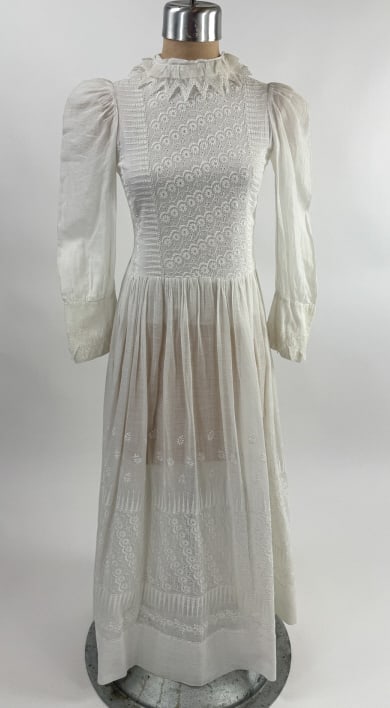 Antique 1900s Cotton Embroidered Lawn Tea Dress: Antique 1900s White Cotton Floral Embroidered Lace Lawn Gown Tea Dress. With floral embroidery at front and hem. Measures 28 inch bust, 24 inch waist, 41 inches long, 20 inch sleeve length.