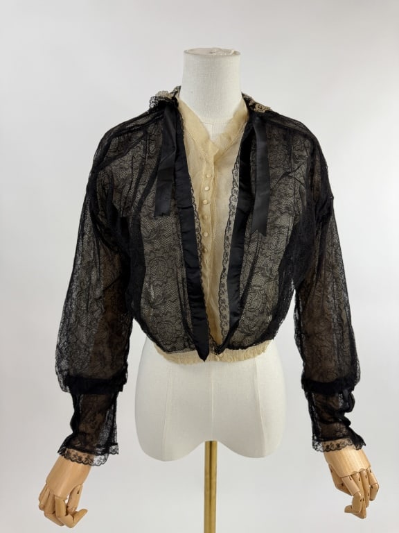Antique 1900s Edwardian Black Floral Net Blouse: Antique 1900s Edwardian Black Floral Net Blouse Top. With lace and silk ribbon details. Snaps up center front to close. Measures 20 inches flat across chest, 32 inch waist, 17 inches long, 19 inch sle