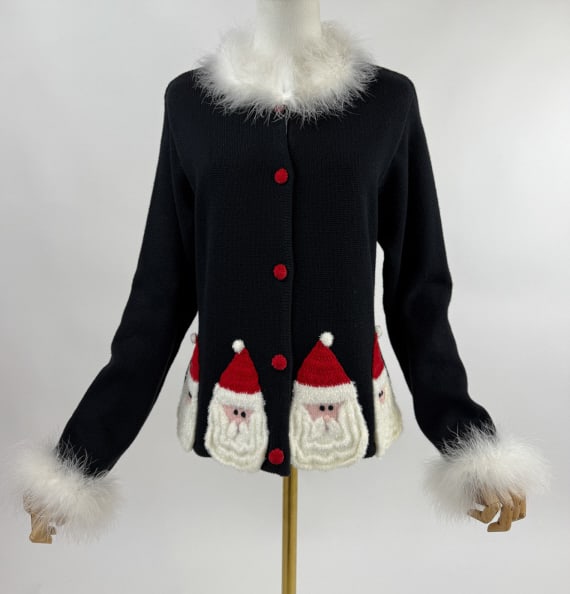Vintage 1990s Marabou Trim Knit Santa Sweater: Vintage 1990s Marabou Trim Knit Santa Cardigan Sweater. Trimmed at neck and cuffs with marabou feathers. Hem is lined with Santa heads. Buttons at front to close. Stretch throughout. Marked size M. Me