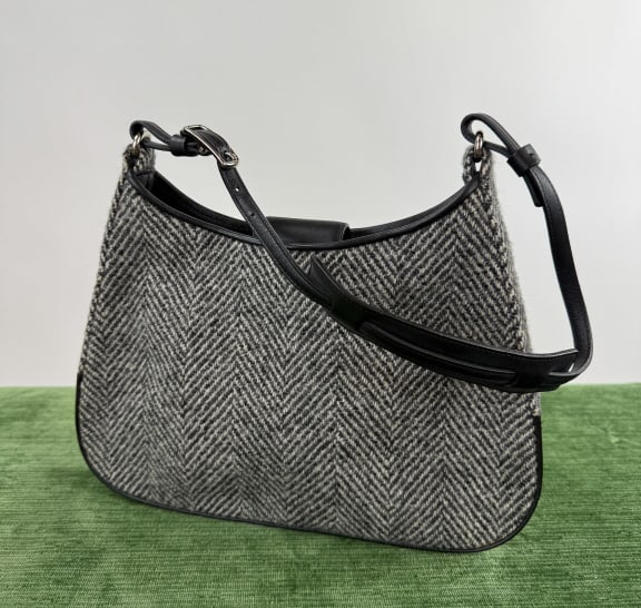 Vintage Coach Wool & Leather Hobo Shoulder Bag: Vintage Coach Herringbone Wool & Leather Hobo Shoulder Bag. Leather strap and details with wool body. Fully lined with inner pocket and logo stamp. Metal magnetic snap closure. Measures approximately