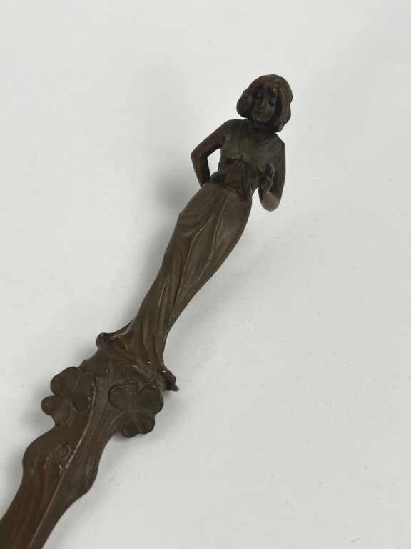 Antique Art Nouveau Bronze Figural Letter Opener: Antique Art Nouveau Bronze Figural Letter Opener. Design of woman and clovers. Measures 11 inches in length.