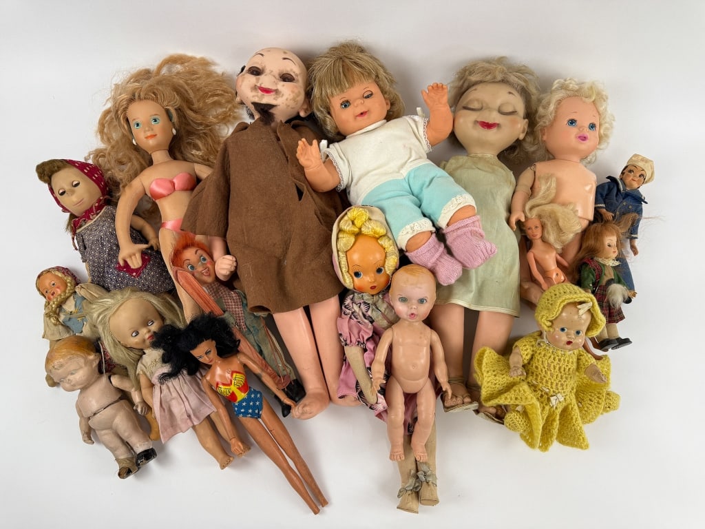 Collection of Vintage 1950s to 1970s Plastic Dolls: Collection of Vintage 1950s to 1970s Plastic Dolls. Including Poor Pitiful Pearl 1950?s doll in its original clothing. Other dolls in their original clothing. Along with Whimsies. Tallest measures 23