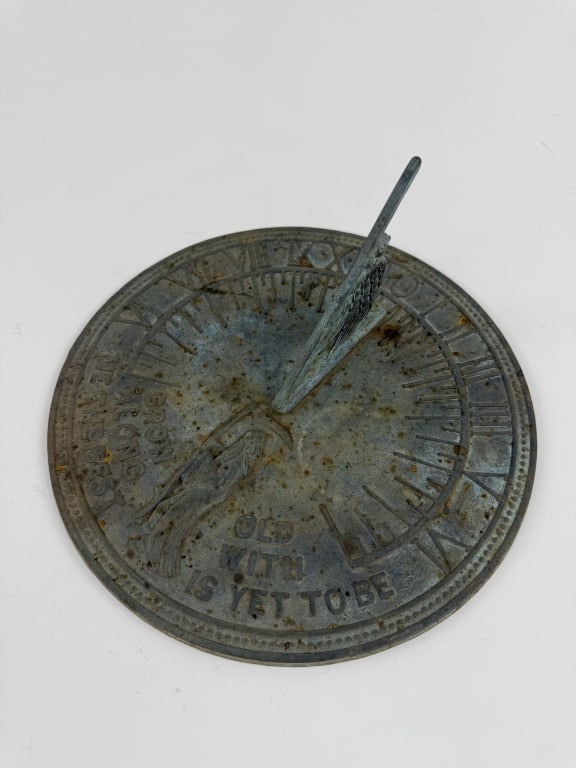 Vintage Cast Iron Garden Statue Sun Dial: Vintage Cast Iron Garden Statue Sun Dial. Inscribed "Grow Old Along With Me The Best Is Yet To Be" and measures 9.5 inches in diameter.